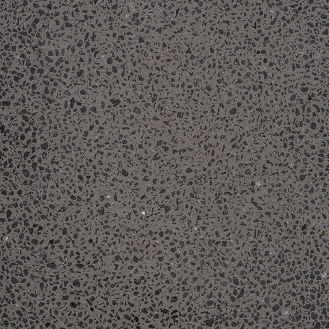 Lähikuva KANE I betoniseinävalaisimen tummasta graniittipinnasta, tyylikäs ja kestävä ulkovalaisin.