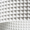 Lähikuva CALLUM RD2 250 seinävalaisimen 3D-tulostetusta tekstuurista, Eco PLA-materiaali.